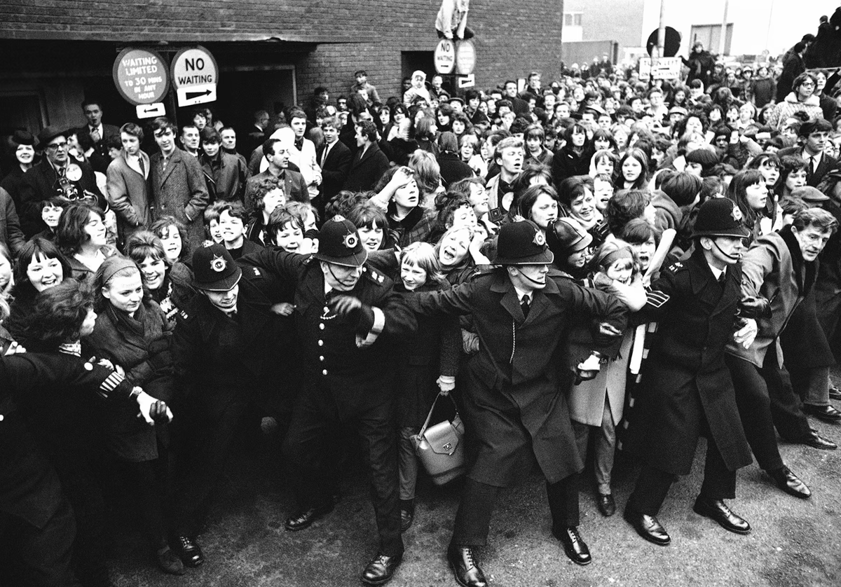 Beatlemania in full swing as the Beatles to London Airport from America on February 22, 1964. Original source: <em>The Atlantic</em>, www.theatlantic.com/photo/2014/05/1964-beatlemania/100745/.